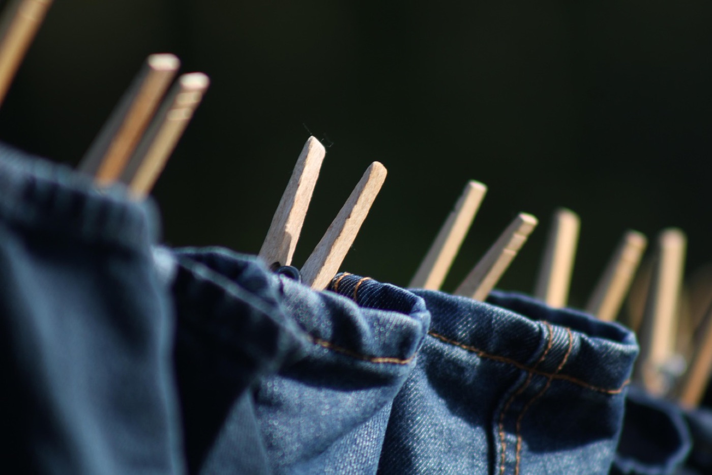 Sewn-in care label with washing and ironing symbols inside a shirt collar