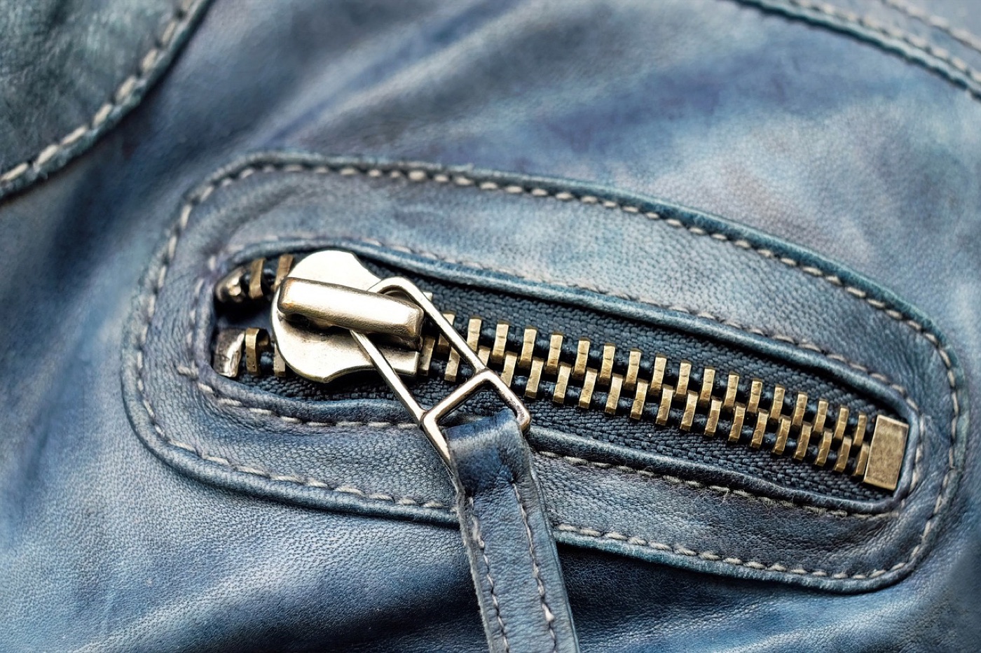 Close-up of a welt chest pocket on a tailored wool jacket