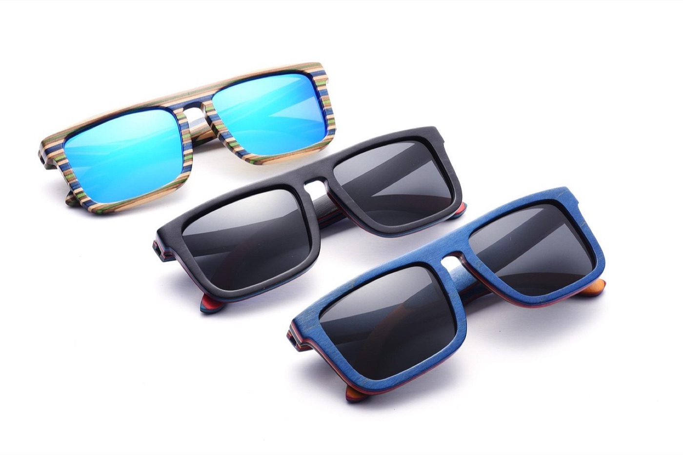 Polarized sunglasses held in front of a water surface to show glare reduction